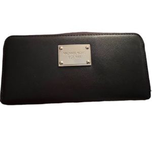 Micheal Kors Large brown zip leather wallet inside zip holds most phones